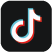 O ícone do TikTok apresenta um símbolo musical estilizado que se assemelha a uma nota musical com um efeito vibrante e tridimensional. A nota está desenhada com uma combinação de cores vibrantes  geralmente azul-ciano, rosa-fúcsia e branco sobre um fundo preto